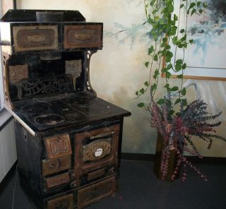 Antique MONARCH CAST IRON COOK STOVE with WARMING OVEN TOP
