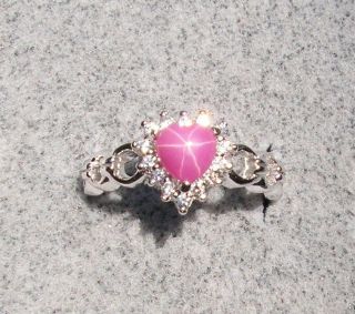   PINK STAR RUBY CREATED SAPPHIRE ACCENTED HEART RHODIUM PLT S/S RING