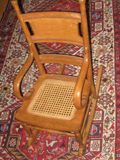   OAK AND BENTWOOD CAINED BOTTOM CHILDS LARGE DOLLS ROCKING CHAIR