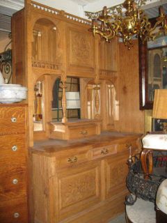 LARGE VICTORIAN LIGHT OAK CARVED MIRRORED CABINET