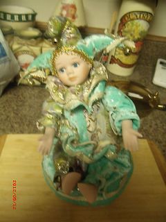   MANN MOVABLE JACK IN THE BOX GIRL DOLL SITTING ON A PILLOW/MUSIC BOX