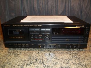   Compact Disc Multi Player/Reverse Cassette Deck + remote + headset