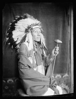 Luke Big Turnips,American Indian,wearing a war bonnet