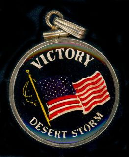   999 SILVER DESERT STORM VICTORY ENCLOS​ED INPLASTIC w/14k GOLD BEZEL