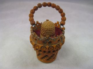 antique carved coquilla nut basket with thimble 19th time left