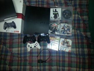 Sony PlayStation 3 Slim 120 GB With 6 games and 3 controllers