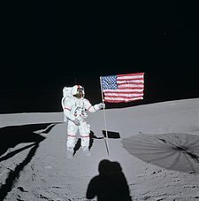 Astronaut Alan Shepard raises the United States Flag on the surface 