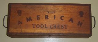    wooden Deluxe American Tool Chest filled with various small tools