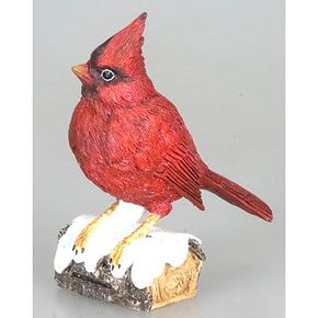   into the world and this cardinal bird on branch statue is a symbol