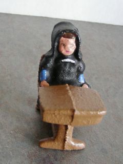 vintage miniature amish dutch girl sitting at school desk cast