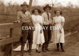 EARLY 1900S COWBOYS & COWGIRLS ON THE BRIDGE COWBOY COWGIRL PHOTO