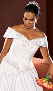 This auction is for a used wedding gown from Davids Bridal, ivory in