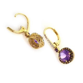 pair of drop earrings are unique and shine with diamonds. The earrings