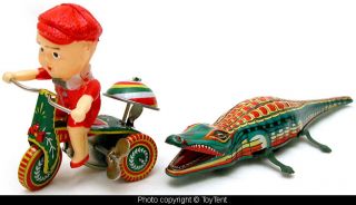 Crocodile chasing boy on tricyle mechanical tin toys boxed