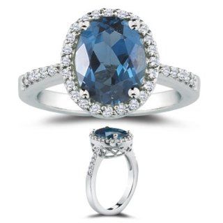 0.29 Cts Diamond & 3.97 Cts London Blue Topaz Ring in 14K