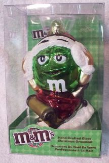 Green M M on Sled Glass Christmas Ornament