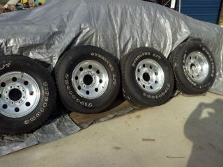 Ford 8 lug 16 inch aluminum wheels with Firestone Steel Tex 16 Inch