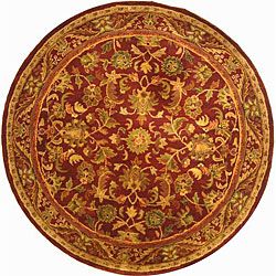 Handmade Exquisite Wine/ Gold Wool Rug (8 Round) (RedPattern: OrientalMeasures 0.625 inch thickTip: We recommend the use of a non skid pad to keep the rug in place on smooth surfaces.All rug sizes are approximate. Due to the difference of monitor colors, 